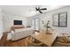 Bright living room featuring hardwood floors, modern furnishings, and a ceiling fan for comfortable living at 1355 Euclid Ne Ave # A8, Atlanta, GA 30307