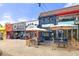 A vibrant commercial street features various storefronts with outdoor seating areas and colorful facades at 1355 Euclid Ne Ave # A8, Atlanta, GA 30307