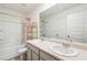 Bathroom with double sinks, white cabinets, and a shower-tub combination at 1469 Cliff View Ter, Conyers, GA 30012