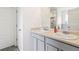 Bathroom features a double sink vanity with white cabinets and a large mirror at 1469 Cliff View Ter, Conyers, GA 30012