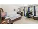 Neutral bedroom with a ceiling fan and carpeted floors at 1469 Cliff View Ter, Conyers, GA 30012