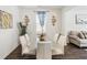 Modern dining room with a white table, stylish chairs, and elegant decor at 1469 Cliff View Ter, Conyers, GA 30012