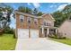 Lovely two-story brick home featuring a welcoming front porch and a spacious driveway at 1469 Cliff View Ter, Conyers, GA 30012