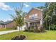 Beautiful two-story home with brick facade, lush green lawn, and mature landscaping at 1469 Cliff View Ter, Conyers, GA 30012