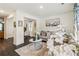 Bright living room with hardwood floors, neutral-toned furniture, and stylish decor at 1469 Cliff View Ter, Conyers, GA 30012