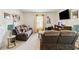 Living room with comfortable seating and a mounted television at 1469 Cliff View Ter, Conyers, GA 30012