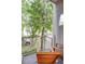 Cozy balcony with wooden chairs and green tree scenery, providing a relaxing outdoor space at 15 Waddell Ne St # 101, Atlanta, GA 30307