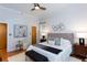 Bright bedroom with a modern ceiling fan, offering a calming atmosphere with stylish decor at 15 Waddell Ne St # 101, Atlanta, GA 30307