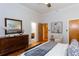 Main bedroom has stylish decor, hardwood flooring, and ensuite bath access at 15 Waddell Ne St # 101, Atlanta, GA 30307