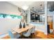 Stylish dining area featuring a modern light fixture and unique mural art, creating an inviting atmosphere at 15 Waddell Ne St # 101, Atlanta, GA 30307