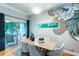 Well-lit dining area with modern decor, a wood table with seating for six, and sliding door to balcony at 15 Waddell Ne St # 101, Atlanta, GA 30307