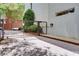Secured gate leading to parking area with mature plantings at 15 Waddell Ne St # 101, Atlanta, GA 30307