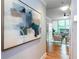 Hallway view leading to a bright living space with hardwood floors and stylish decor at 15 Waddell Ne St # 101, Atlanta, GA 30307
