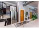 Stylish kitchen features stainless steel appliances, dark wood cabinets, and quartz countertops at 15 Waddell Ne St # 101, Atlanta, GA 30307