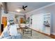 Bright living room boasts contemporary decor, hardwood floors, and a stylish murphy bed with bookshelves at 15 Waddell Ne St # 101, Atlanta, GA 30307