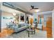 Sun-filled living room showcases hardwood floors, exposed ductwork, and access to the kitchen at 15 Waddell Ne St # 101, Atlanta, GA 30307