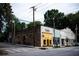 Charming street view featuring neighborhood businesses with colorful storefronts and a vintage aesthetic at 15 Waddell Ne St # 101, Atlanta, GA 30307
