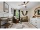 Charming Bedroom with a crib, changing table, and a cozy armchair at 6403 Queens Court Trce, Mableton, GA 30126