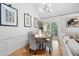 Charming dining area with modern light fixture, seating four, and an abundance of natural light at 6403 Queens Court Trce, Mableton, GA 30126