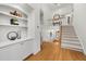 Spacious foyer featuring hardwood floors, staircase, and built-in shelving at 6403 Queens Court Trce, Mableton, GA 30126