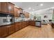 Gourmet kitchen with stainless steel appliances, granite countertops, and warm wood cabinetry open to the living room at 6403 Queens Court Trce, Mableton, GA 30126
