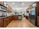 Spacious kitchen boasts stainless appliances, granite counters, ample cabinetry, and seamless flow to living area at 6403 Queens Court Trce, Mableton, GA 30126