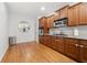 Bright kitchen with stainless appliances, warm wood cabinets, tile backsplash, and eat in breakfast nook at 6403 Queens Court Trce, Mableton, GA 30126