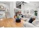 Open-concept living room with high ceilings, hardwood floors, and lots of natural light at 6403 Queens Court Trce, Mableton, GA 30126