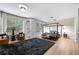 Bright main bedroom with hardwood floors, sitting area, and lots of windows at 6403 Queens Court Trce, Mableton, GA 30126