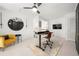 Bright home office featuring built-ins, desk, and comfortable yellow chair at 6403 Queens Court Trce, Mableton, GA 30126