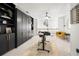 Modern home office featuring custom built-ins, a desk, and a comfortable chair at 6403 Queens Court Trce, Mableton, GA 30126