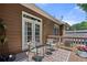 Outdoor patio featuring a wooden deck, comfortable seating, and a view of the surrounding greenery at 6403 Queens Court Trce, Mableton, GA 30126