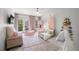 Bright playroom with pink accents, a ball pit, and a cozy teepee at 6403 Queens Court Trce, Mableton, GA 30126