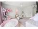 Stylish playroom featuring ball pit, teepee, pink tree, and soft seating at 6403 Queens Court Trce, Mableton, GA 30126