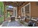 Relaxing porch with hanging swings, view of the yard, and convenient access to the lower-level at 6403 Queens Court Trce, Mableton, GA 30126