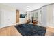 Sitting area with hardwood floors, large windows, and modern decor at 6403 Queens Court Trce, Mableton, GA 30126