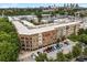Stunning aerial view of the multi-Gathering property, featuring ample parking, balconies, and commercial space below at 898 Oak Sw St # 1301, Atlanta, GA 30310