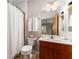 Bathroom featuring a toilet, vanity with storage, and a shower with a curtain at 898 Oak Sw St # 1301, Atlanta, GA 30310