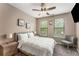 Comfortable bedroom with ceiling fan, plush carpeting, side tables, and natural light at 898 Oak Sw St # 1301, Atlanta, GA 30310