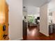 Entryway with wood floors leading to the living room with bright natural light and an open floorplan at 898 Oak Sw St # 1301, Atlanta, GA 30310