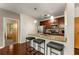 Kitchen featuring granite countertops, stainless steel appliances, and bar stool seating at the island at 898 Oak Sw St # 1301, Atlanta, GA 30310