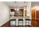 Kitchen featuring granite countertops, stainless steel appliances, and bar stool seating at the island at 898 Oak Sw St # 1301, Atlanta, GA 30310
