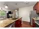 Kitchen featuring a large sink, granite countertops, and stainless steel appliances, with bar seating at 898 Oak Sw St # 1301, Atlanta, GA 30310
