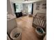 Bright bedroom with neutral walls, sleek flooring, crib and natural light at 241 Wooten Ct, Canton, GA 30114