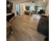 Open-concept living room features modern flooring, a comfortable couch and lots of natural light at 241 Wooten Ct, Canton, GA 30114