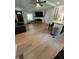 Bright living room features modern flooring, a cozy seating area, and a seamless transition to the updated kitchen at 241 Wooten Ct, Canton, GA 30114