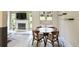 Cozy dining area with a fireplace view, complemented by tile flooring and large windows showcasing the outdoor scenery at 3268 Clairmont North Ne Rd, Brookhaven, GA 30329