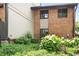 A brick building has multiple windows with green foliage and plants in front of it on a sunny day at 3268 Clairmont North Ne Rd, Brookhaven, GA 30329