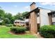 Brick townhome with balconies and manicured landscaping at 3268 Clairmont North Ne Rd, Brookhaven, GA 30329