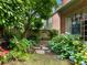 Lush backyard featuring a stone pathway, mature plantings, and a private, serene atmosphere at 350 Fountain Oaks Ln, Atlanta, GA 30342